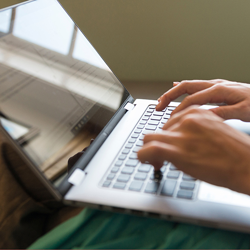 Typing on laptop