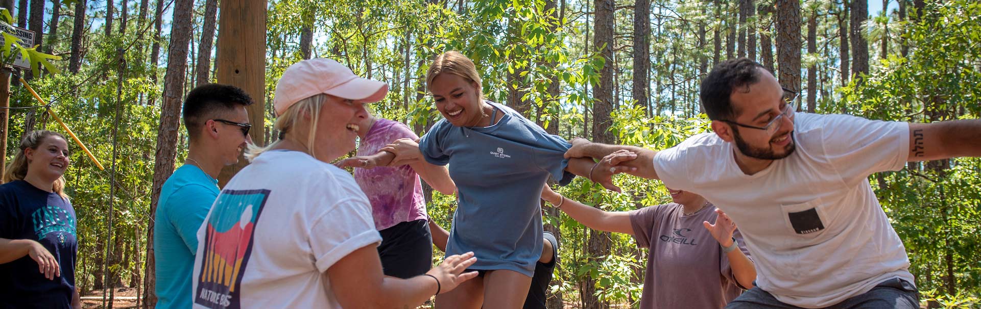 Team of students doing an exercise on the challenge course