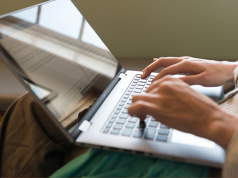 a person working on a laptop.