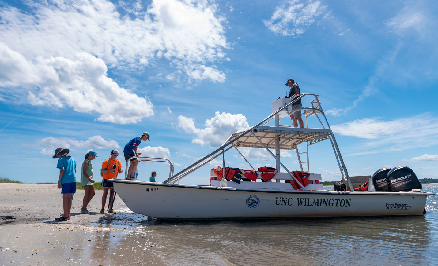 UNCW boat beached on Masonboro Island