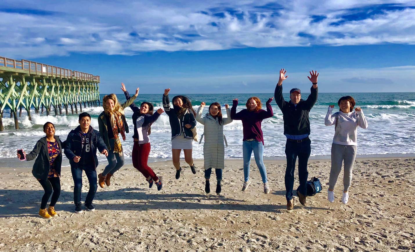 Group jumping at beach