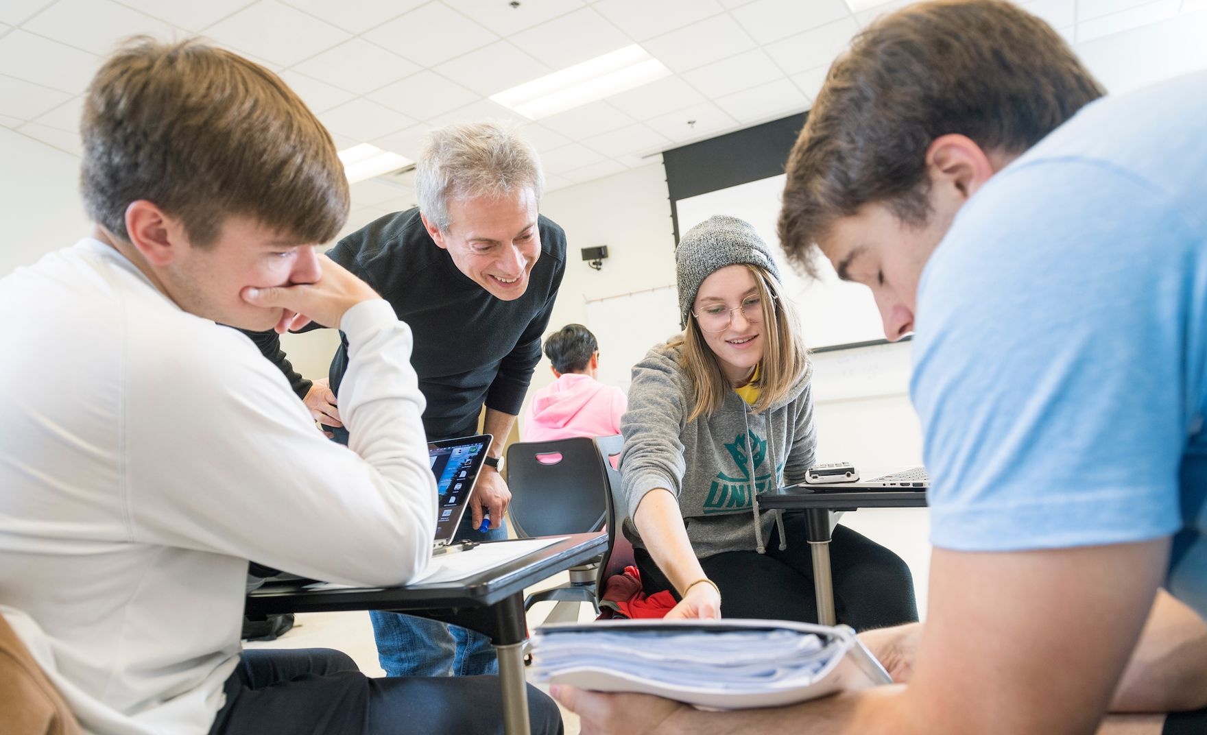 instructor studying with students