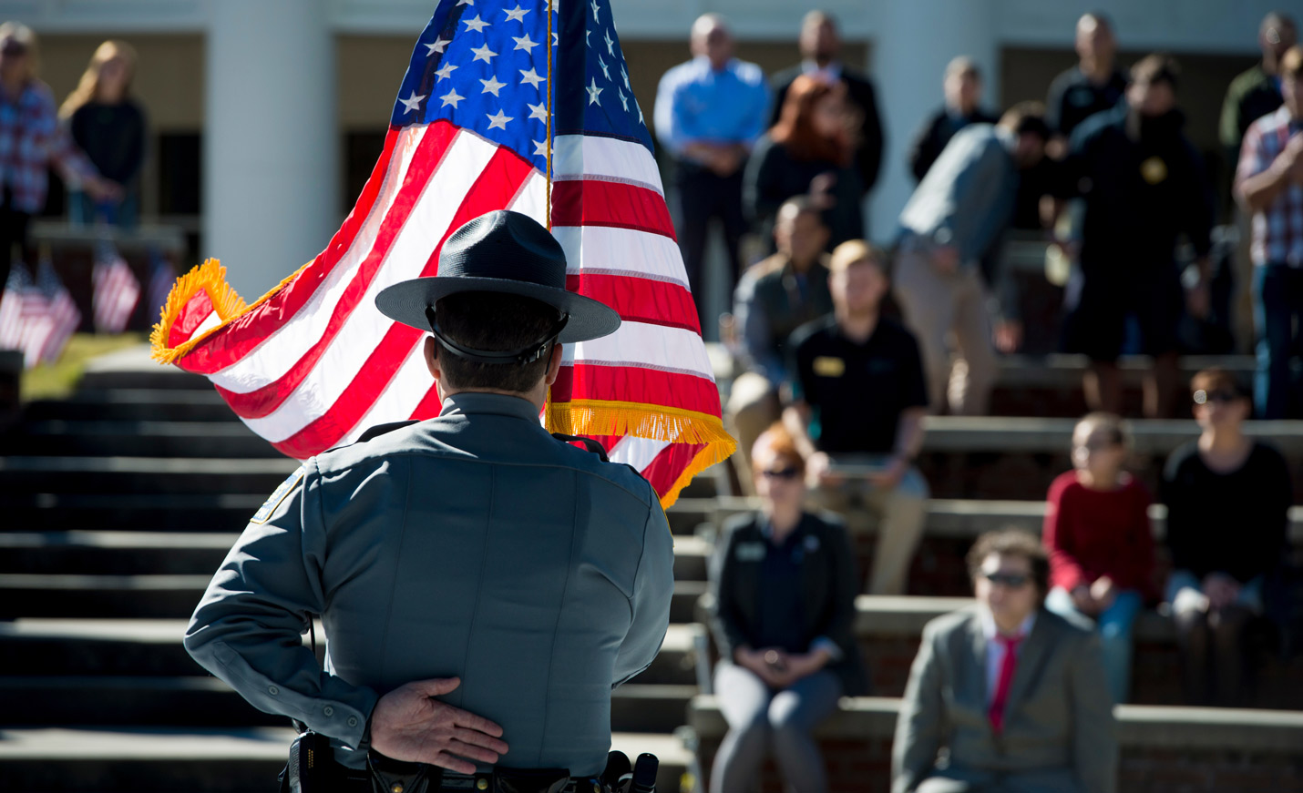 Police holding a flag
