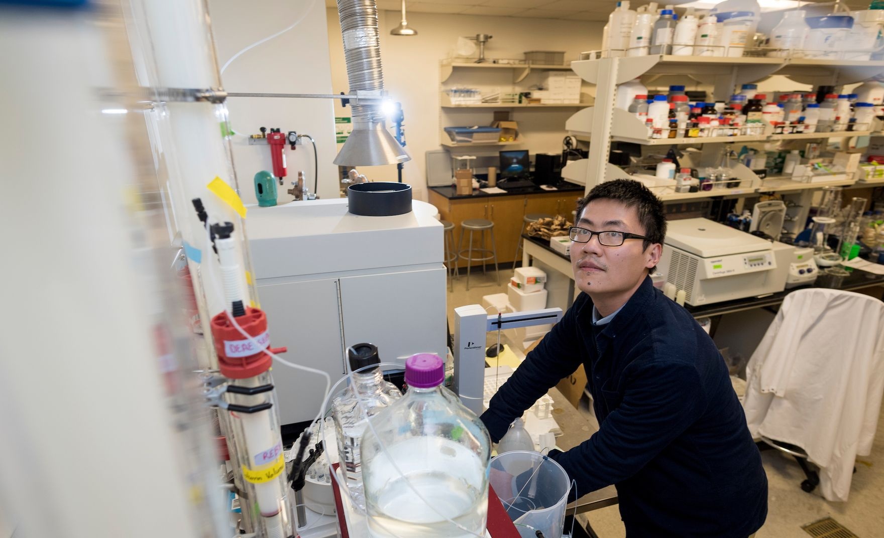 man in lab controlling lab tools
