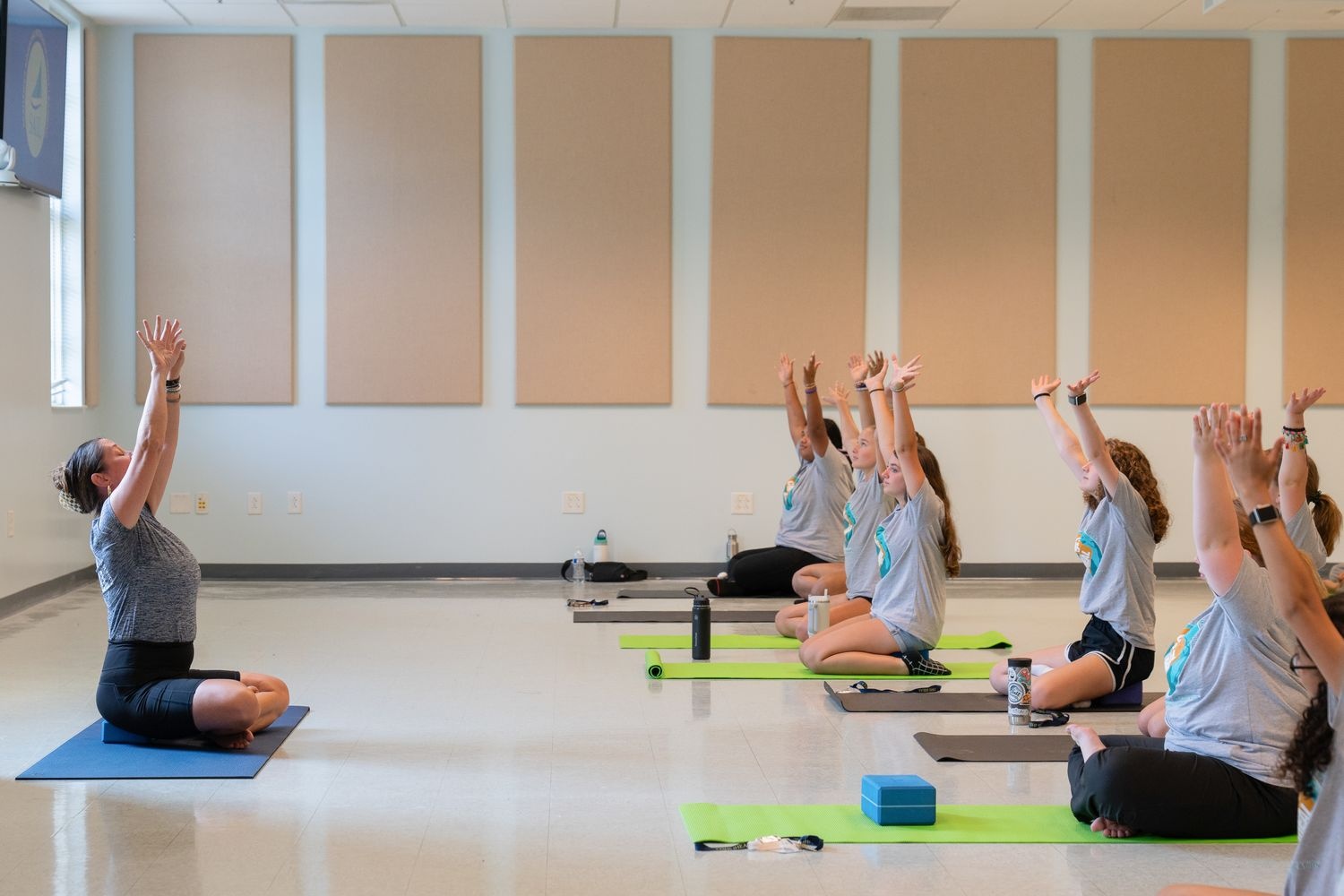 iHEAL summer campers participate in a yoga activity to learn about health and wellness.