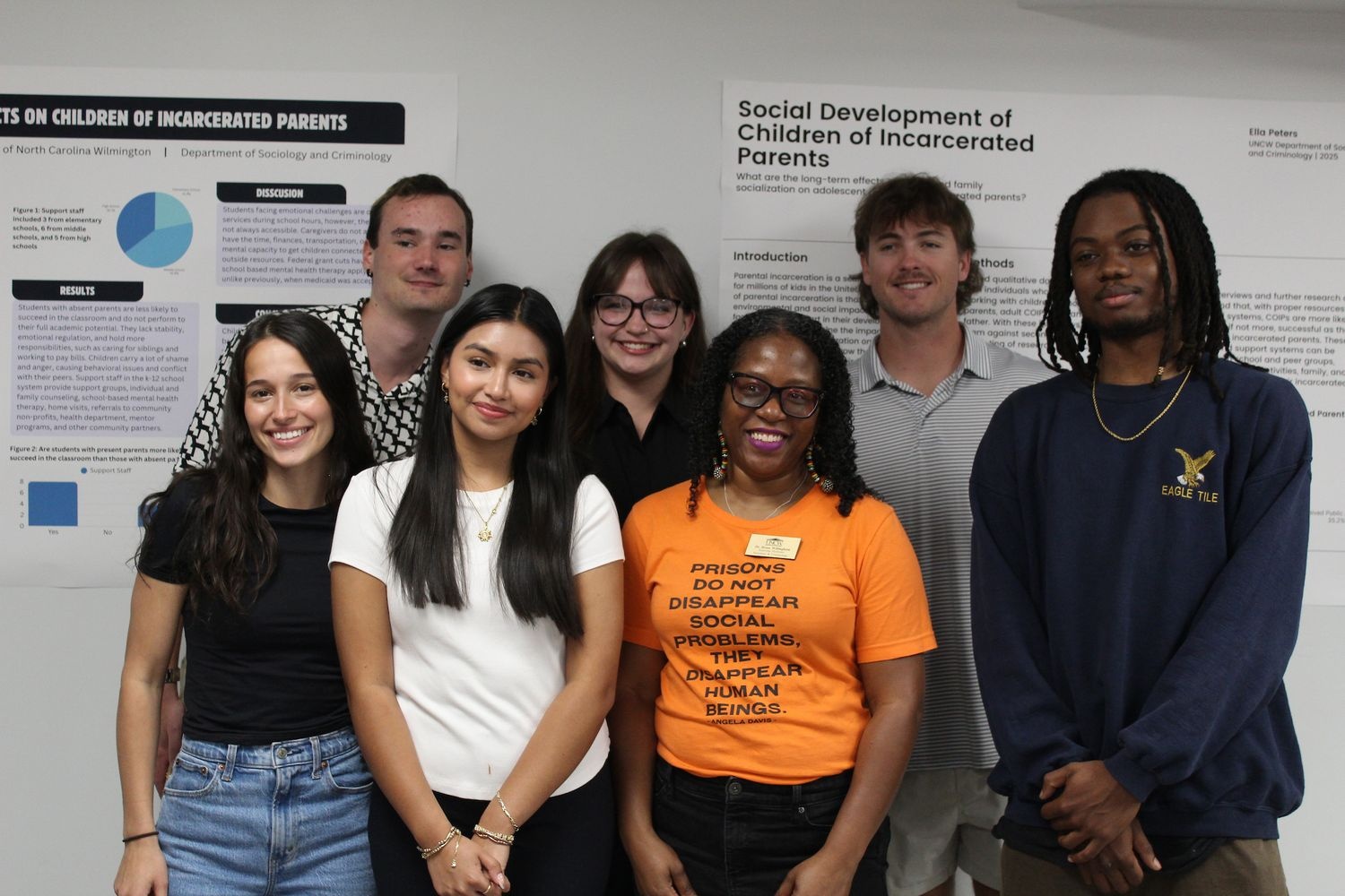 Students and faculty pose at a research showcase event
