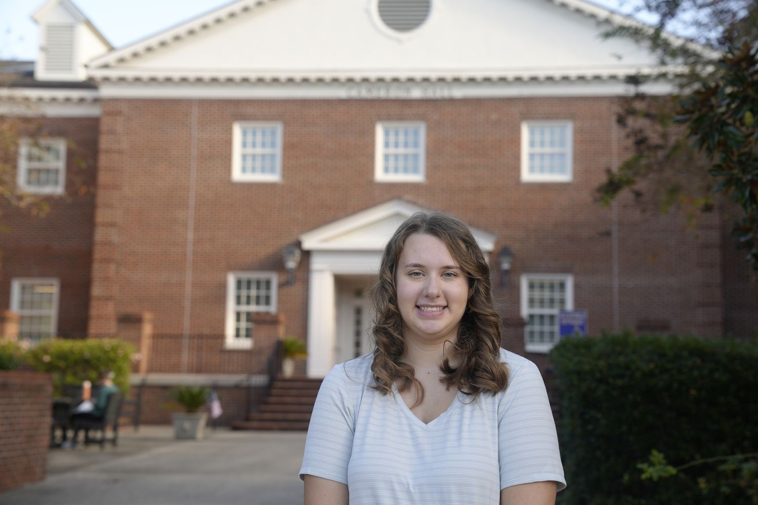Photo of student spotlight Anika Danner outside of Cameron Hall