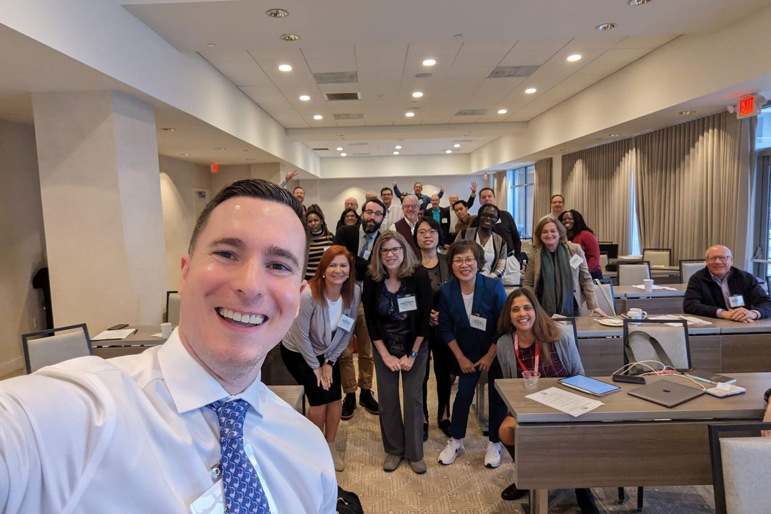 Economics Teacher Conference group of attendees take photo together smiling