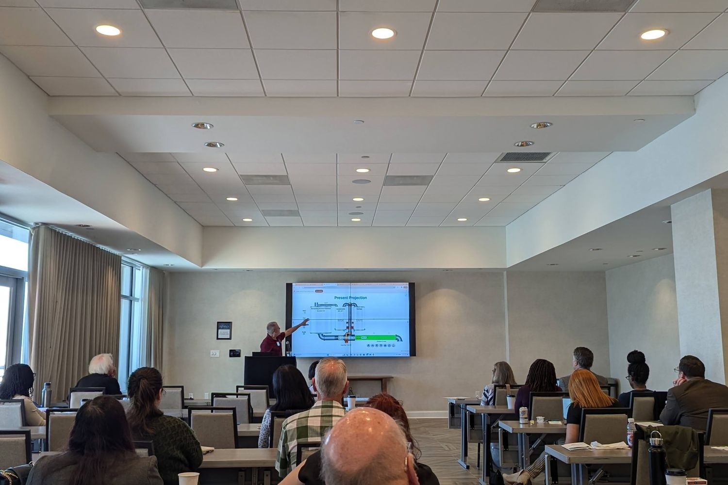 Economics Teacher Conference presenter speaking to attendees