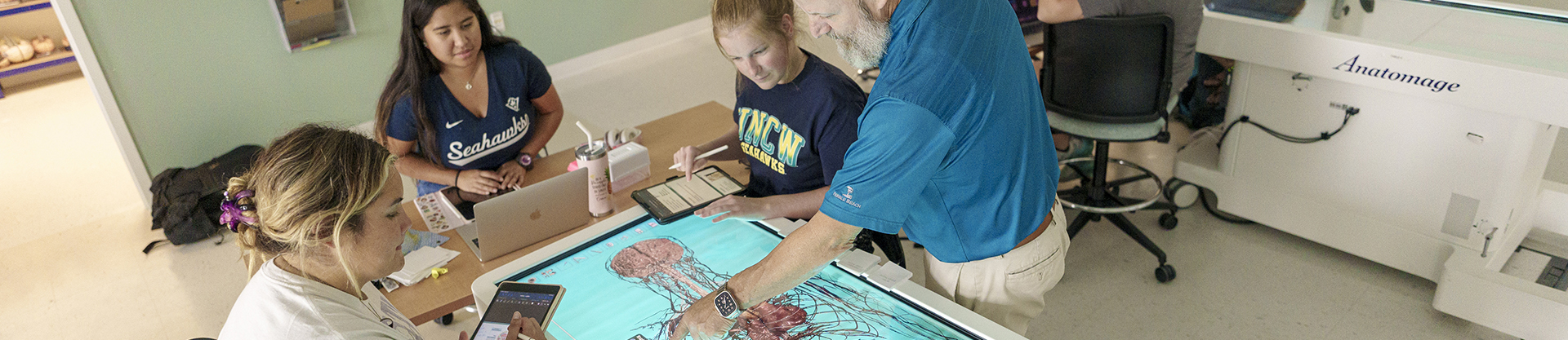 students looking at technical equipment