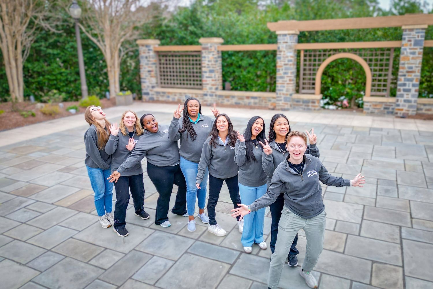 Advise NC team cheering in a line during training. 