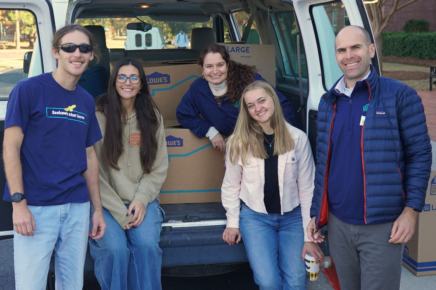 Adopt a Family volunteers packing a van together