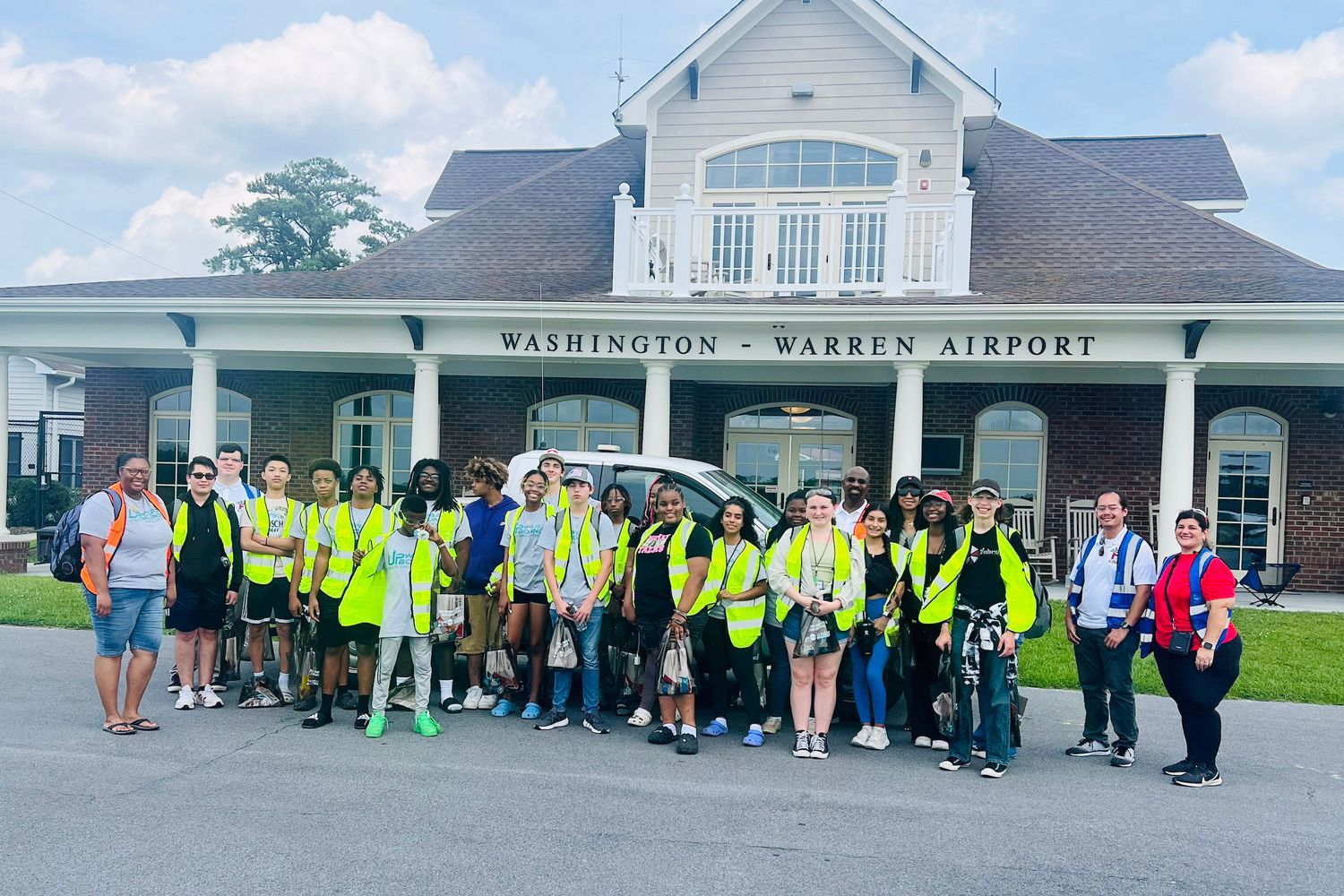 Upward Bound students outside aeronautical center