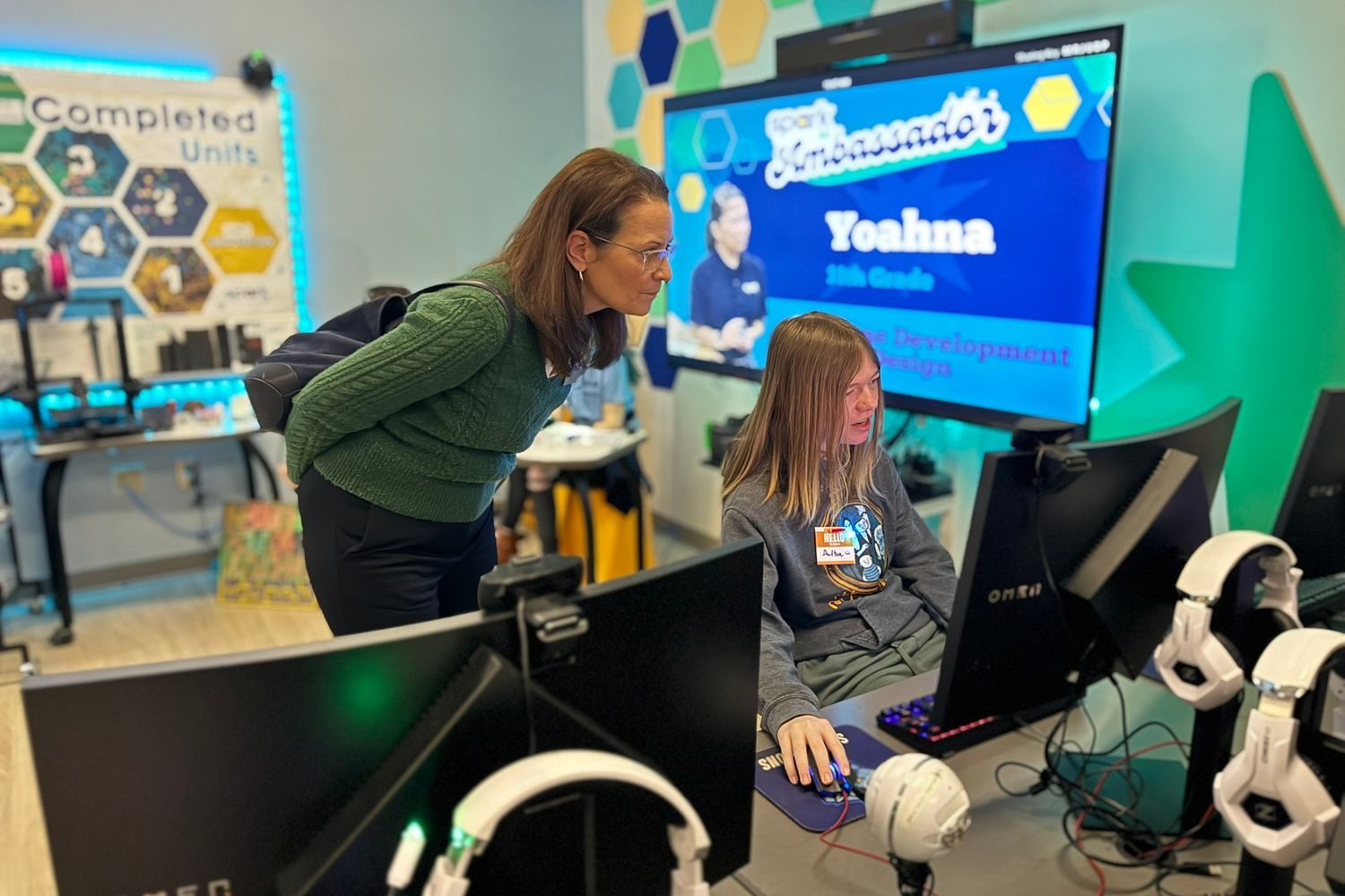 Dean Linderholm watches a student in the SEA-Tech SparkLab