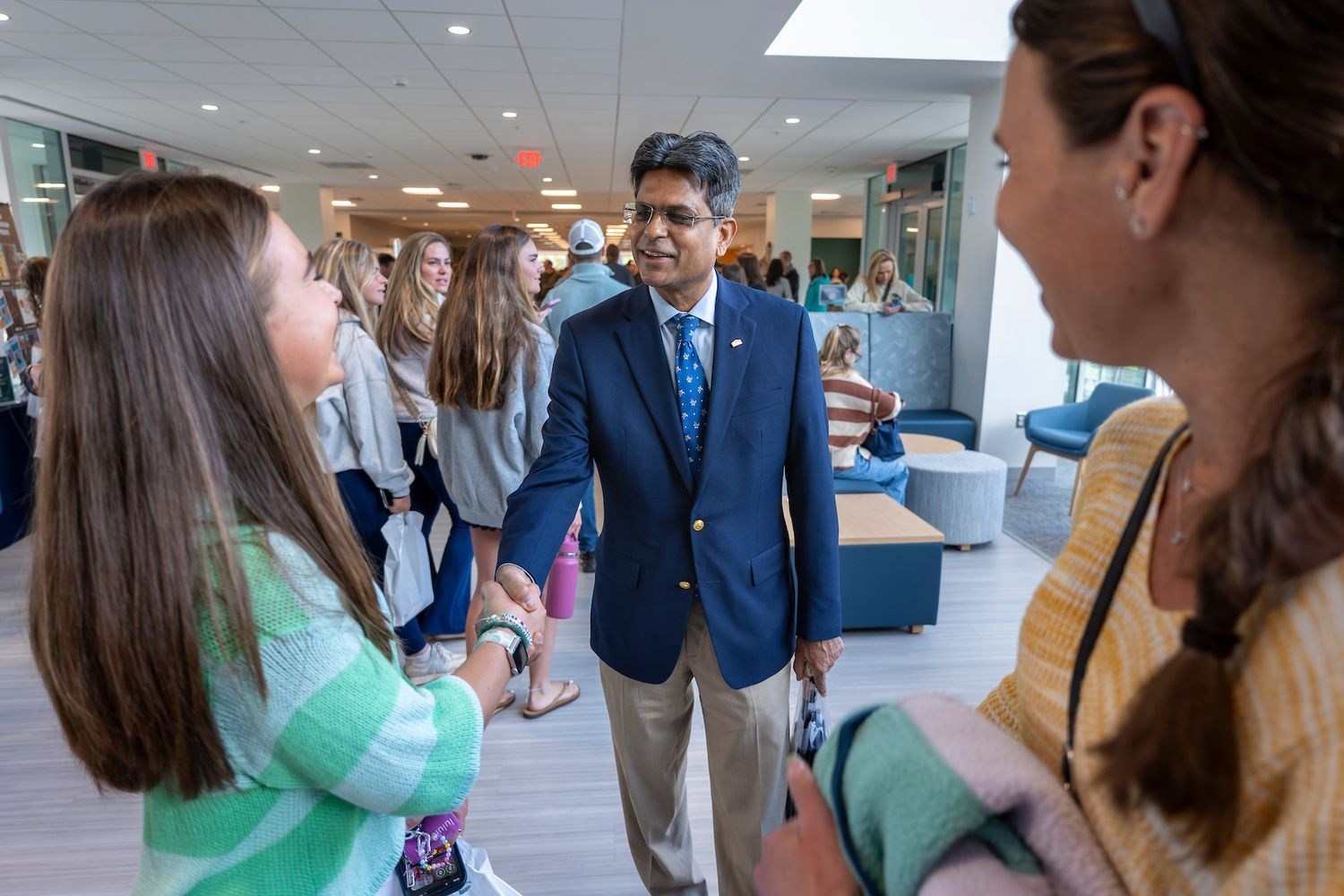 Chancellor Volety shakes hands with future students in Discovery Hall