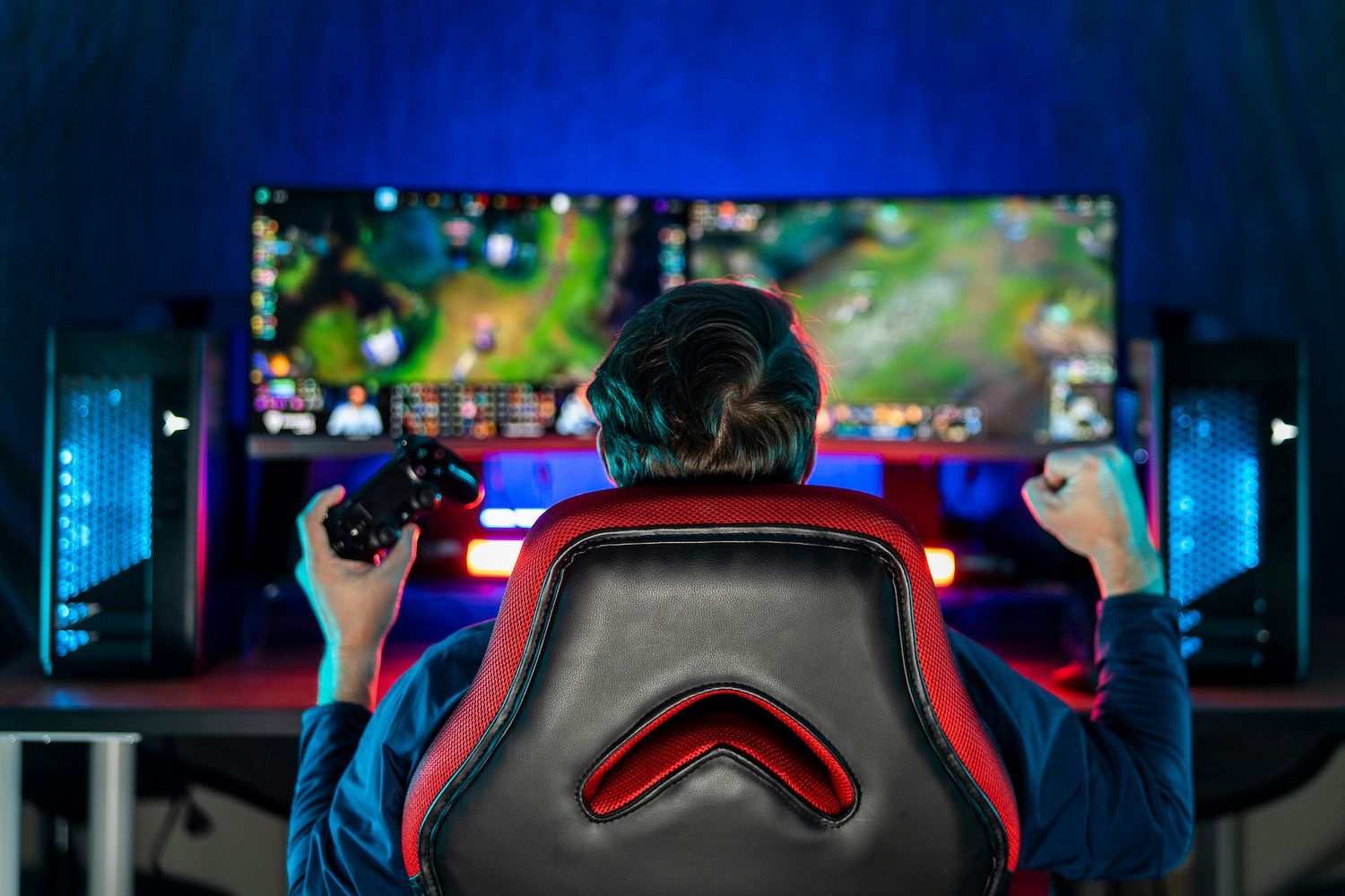 Student playing video game showing excitement