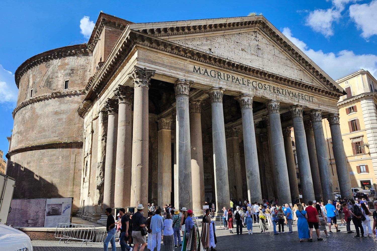People standing in front of the Pantheon in Rome.