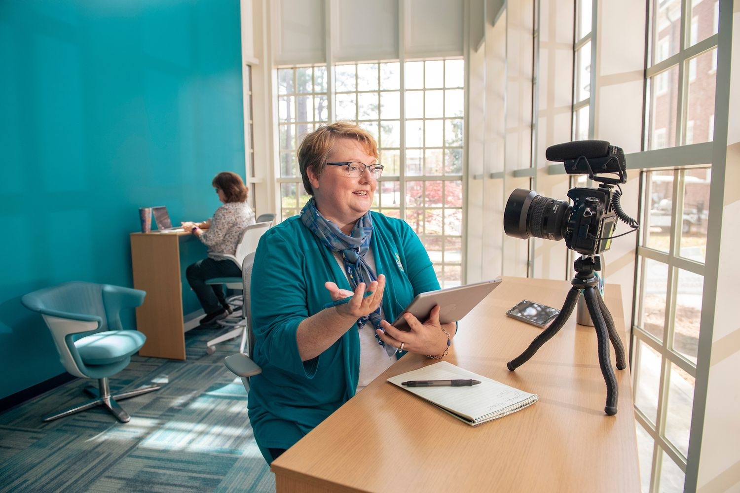 teacher looking at camera for virtual teaching