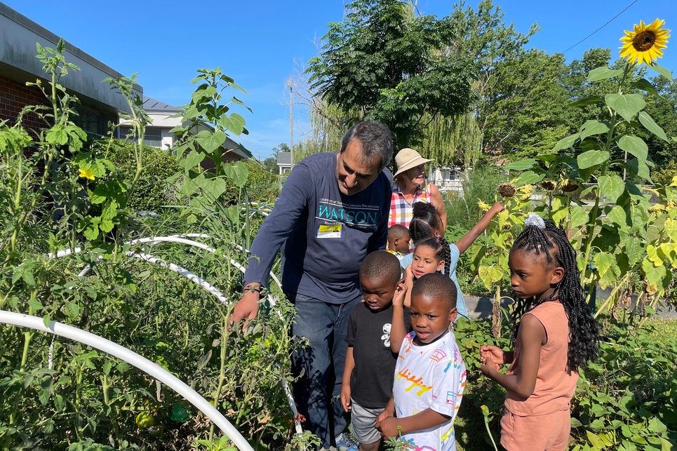 group of kids with adults at dc virgo garden