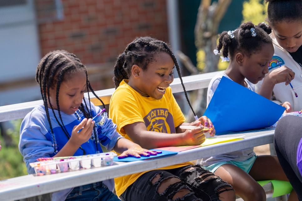 kids air painting on bleachers