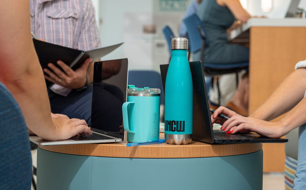 Student sitting outside on a laptop