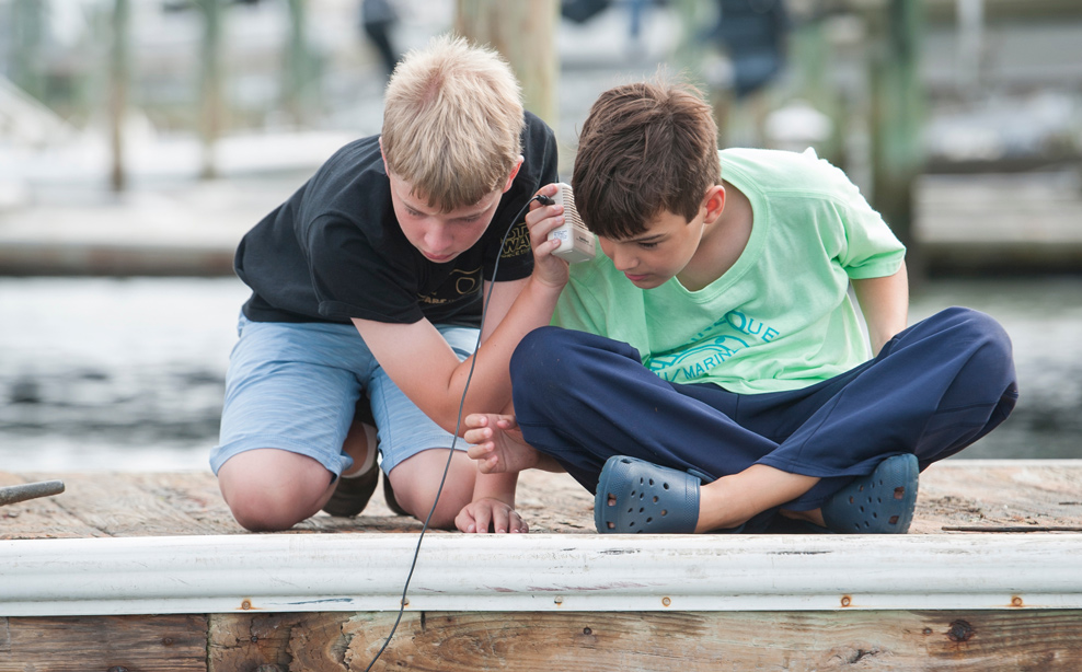 Kids playing on boat dock