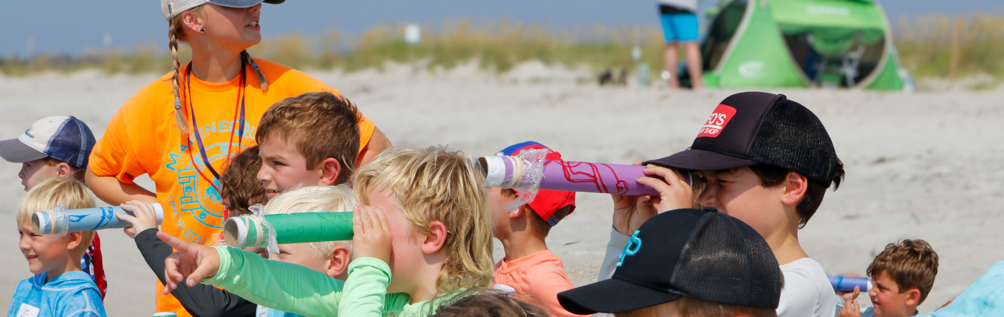 Camp youth using paper telescopes
