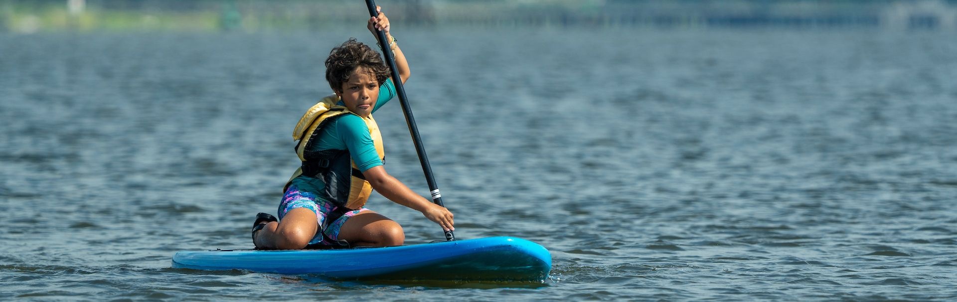 Camp youth paddle boarding