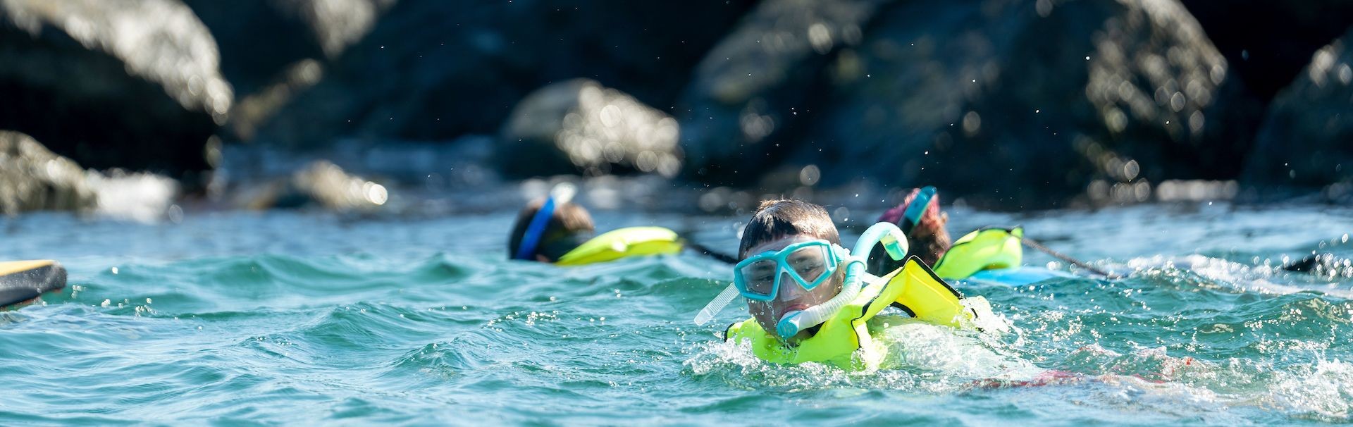 students in snorkeling gear swimming for snorkeling course