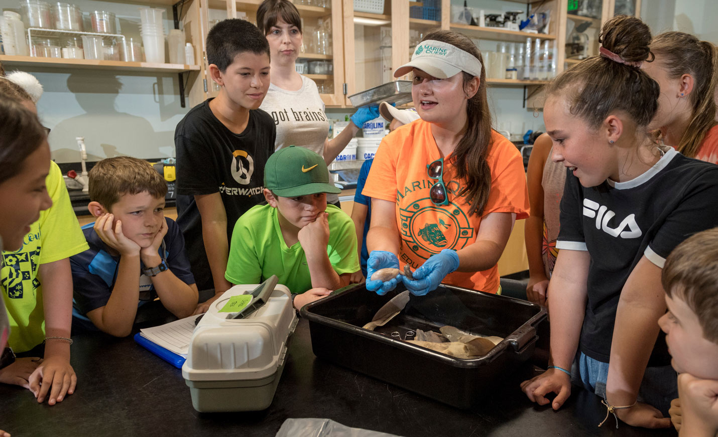 MarineQuest students and instructor examine a shark