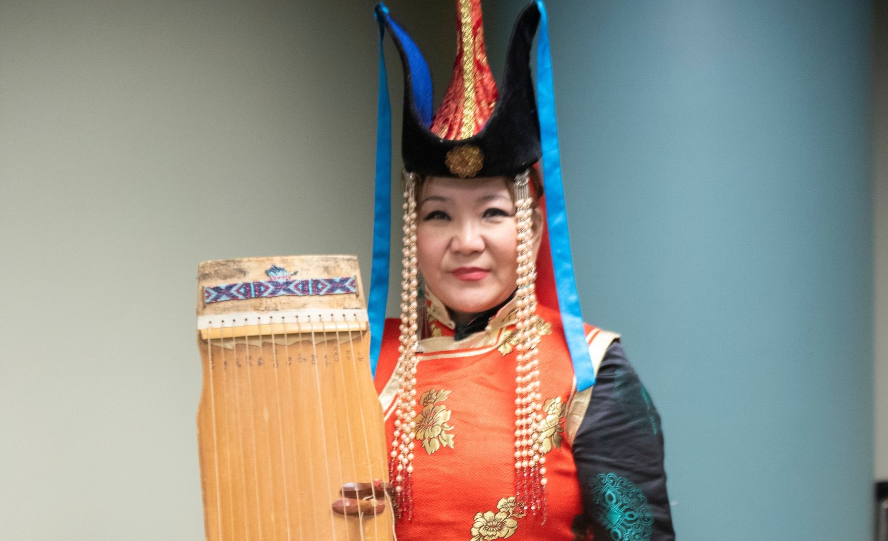 AHCC member holds instrument