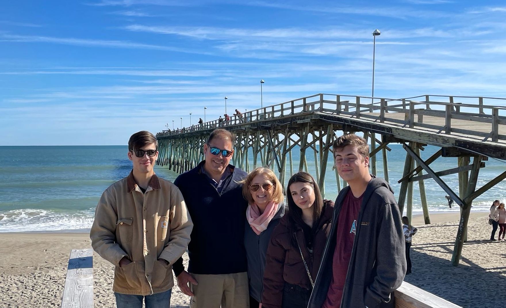 group of iss students on beach